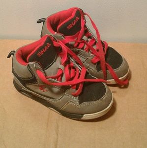 Grey & red Shaq shoes.